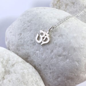 Spiritual anklet with a silver ohm sign charm.