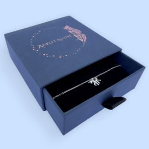 Anklet with a cute unicorn charm, perfect for a little girl, presented in a blue jewellery box with Anklet Allure written on the top in rose gold.