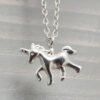 Close up of sterling silver anklet with unicorn charm.