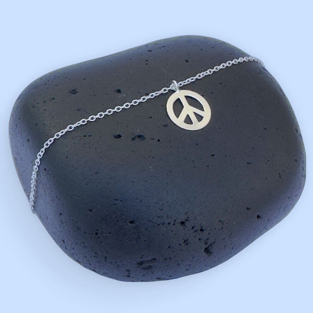 A19-Anklet-(1) Silver anklet with a peace symbol charm.