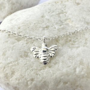 Sweet silver anklet with pendant attached of a bee.