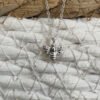 Sterling silver bee charm on a silver ankle bracelet.