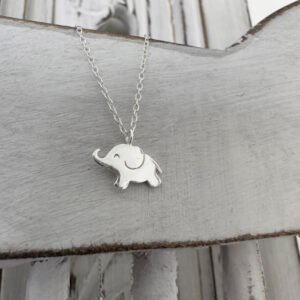 Cute sterling silver elephant charm on a silver ankle bracelet.