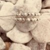 Double chain silver ankle bracelet with eight balls on each of the chains, alternating shiny silver then rough frosted silver.