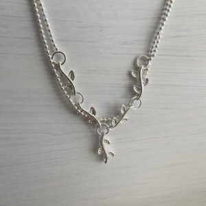 Sterling silver double chain anklet with a solid silver interlinked plant roots feature.