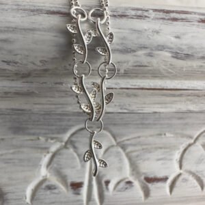 Sterling silver anklet with a solid silver roots feature interlinked on a dainty double chain.