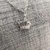 Shiny sterling silver pencil chain with royal crown charm with cubic zirconia detail