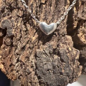 Single shiny sterling silver heart on an ankle chain.