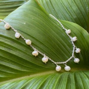 An anklet fit for a princess, made up of elegant freshwater pearls spaced equally around the chain.
