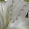 Elegant freshwater pearls at equal distance apart, around a shiny sterling silver ankle chain.